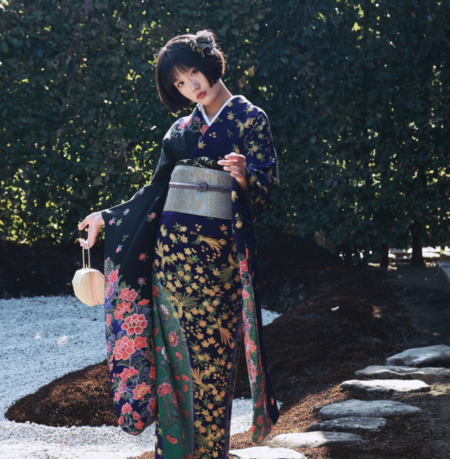 Foreign traveler experiencing an authentic kimono dressing process and walking in historic Kyoto