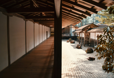 Zen Buddhist monk meditating in Kyoto rock garden