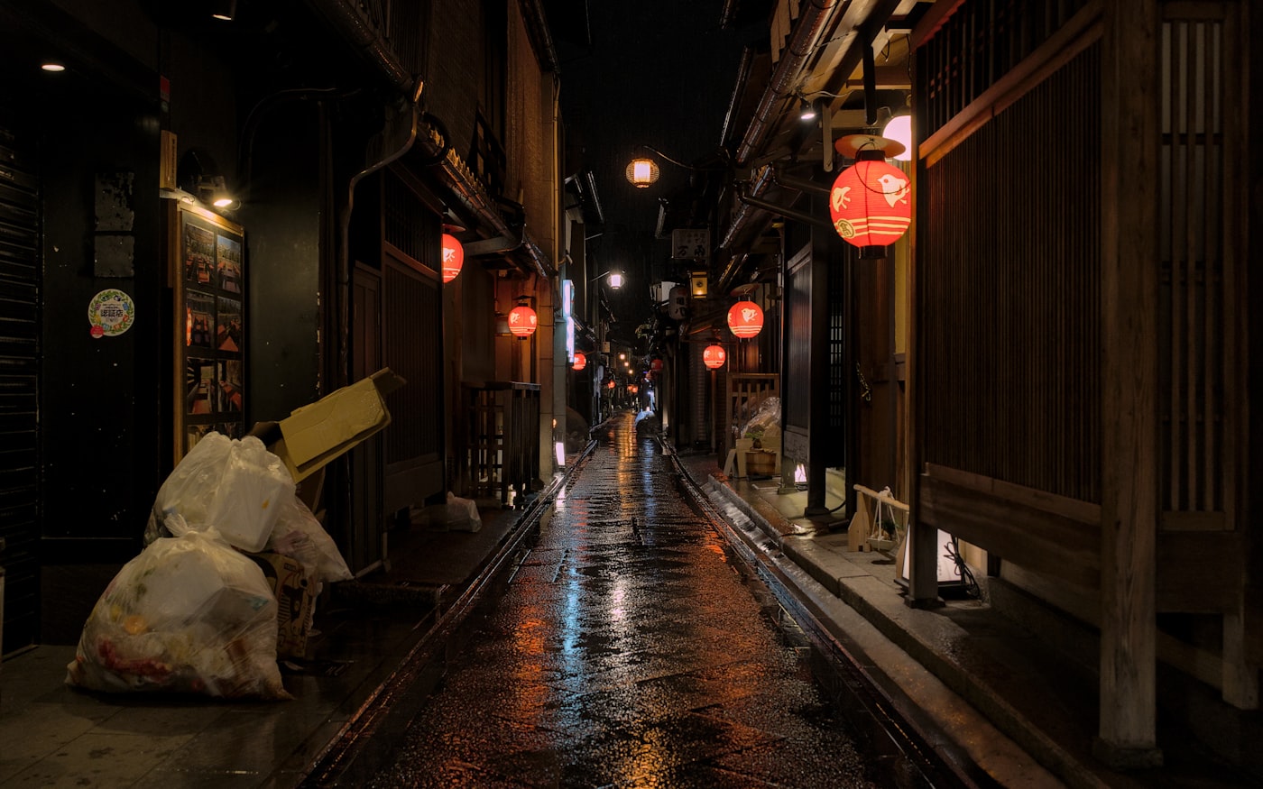 Pontocho alley at night with paper lanterns and restaurant signs