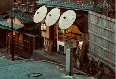 Traveler wearing a premium silk kimono walking down Ninenzaka street