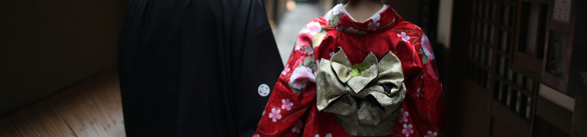 Beautiful Maiko and Geisha walking in traditional Gion street in Kyoto during evening