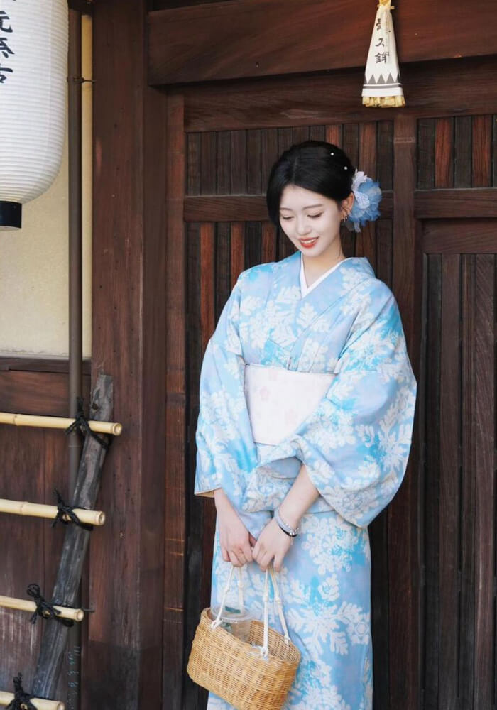 Foreign couple wearing traditional Japanese kimono strolling in Kyoto temple grounds