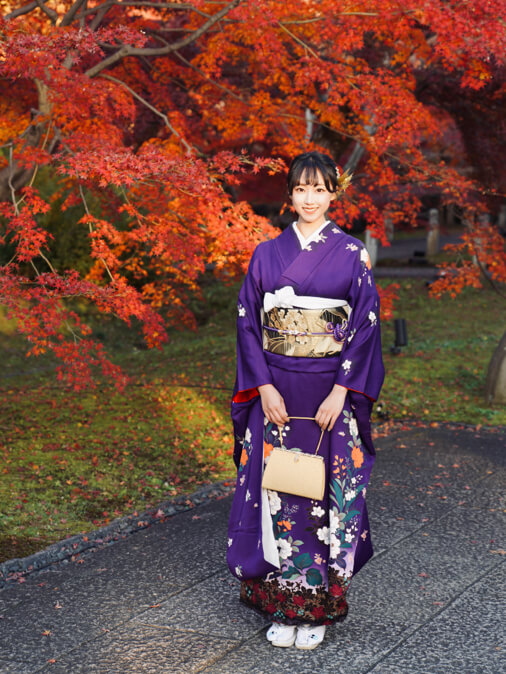 Vibrant red autumn leaves momiji at a Kyoto temple during fall foliage season